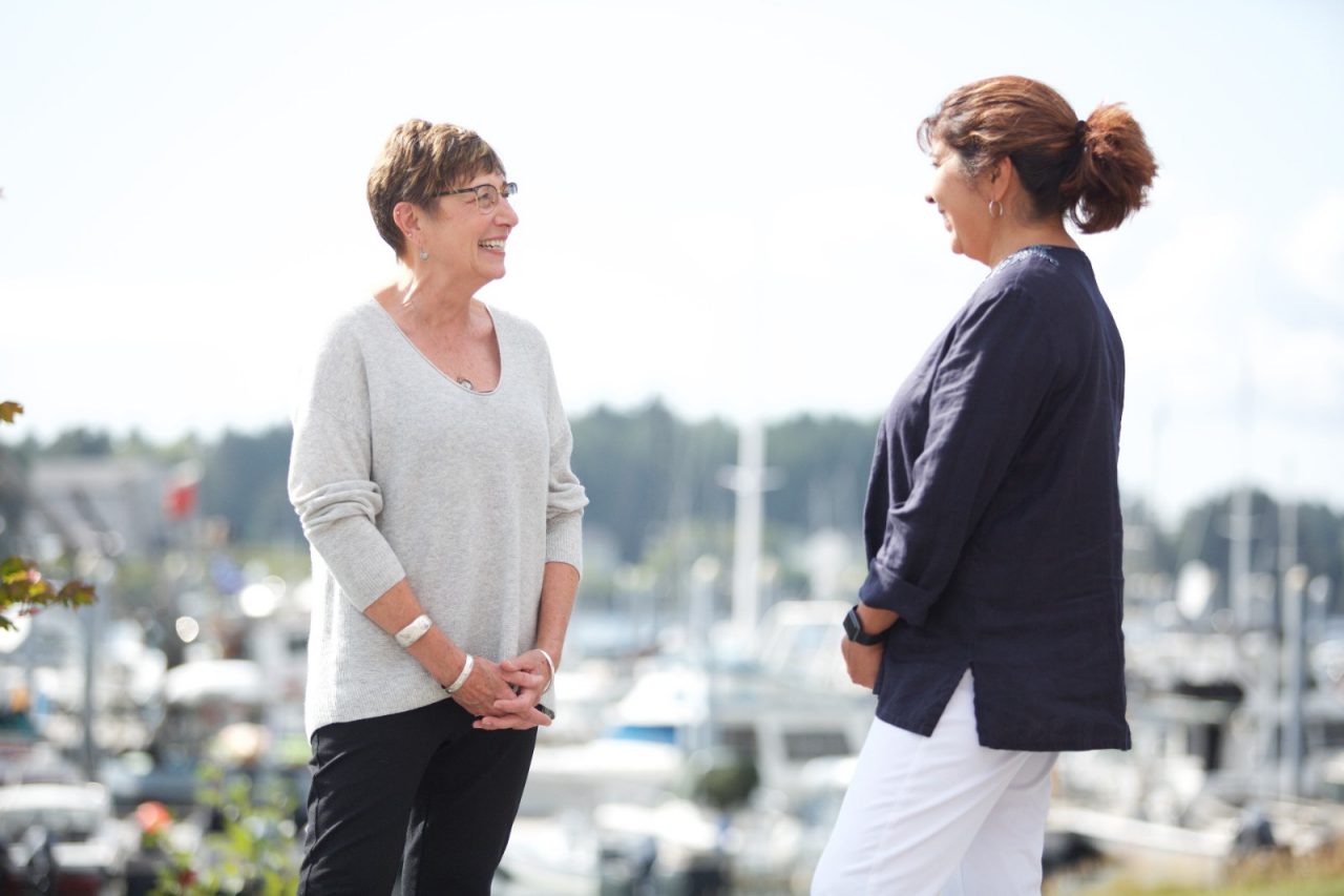 SITKA, ALASKA - SEPTEMBER 2019: Melonie Boord, Director of Sitka Tribe of Alaska Social Services, and Kathy Branch, Child Protection Supervisor for Alaska Office of Children's Services talk outside their offices.