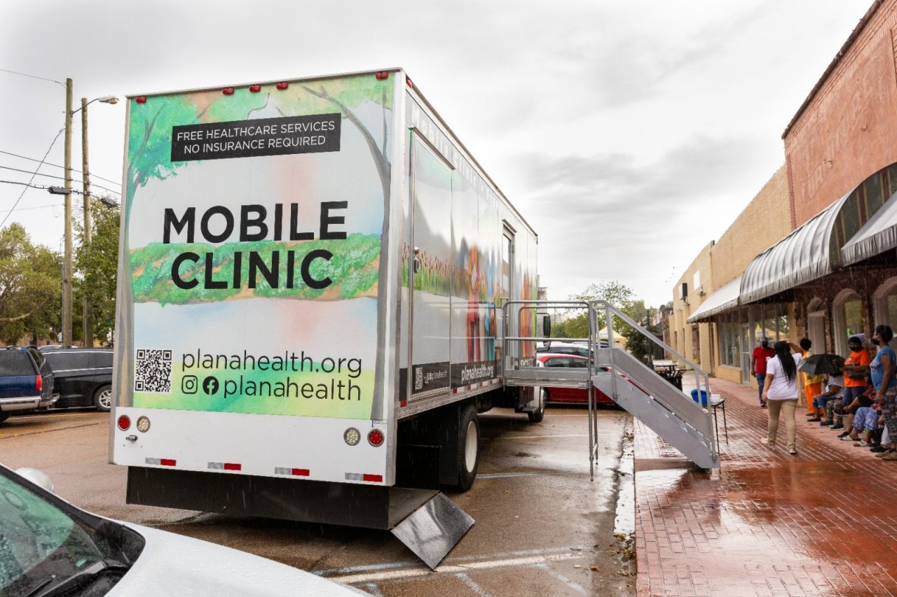 Residents line up outside of the Mae Bertha Carter Learning Center in Drew, Mississippi for the Plan A mobile clinic.  Plan A provides free healthcare services to communities in the Delta and do not require insurance.