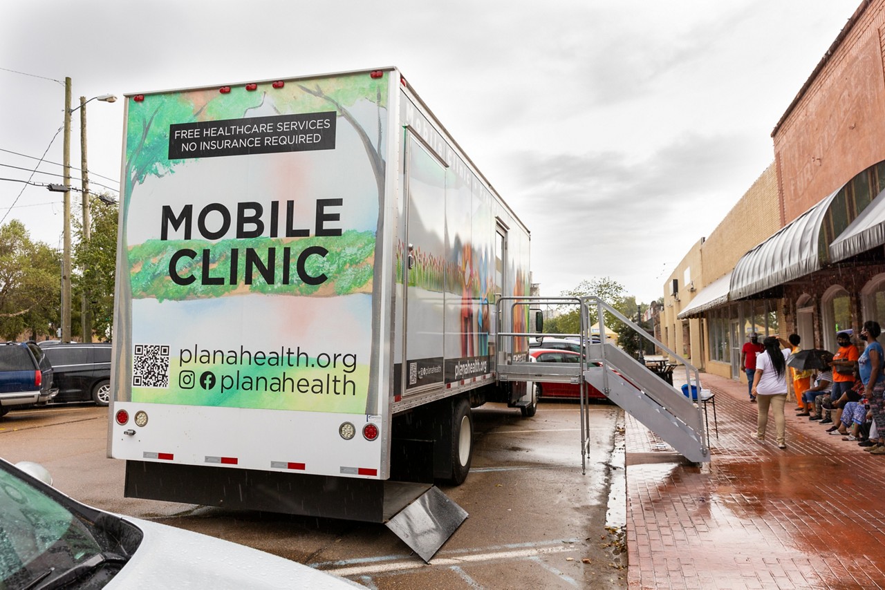 Residents line up outside of the Mae Bertha Carter Learning Center in Drew, Mississippi for the Plan A mobile clinic.  Plan A provides free healthcare services to communities in the Delta and do not require insurance.
