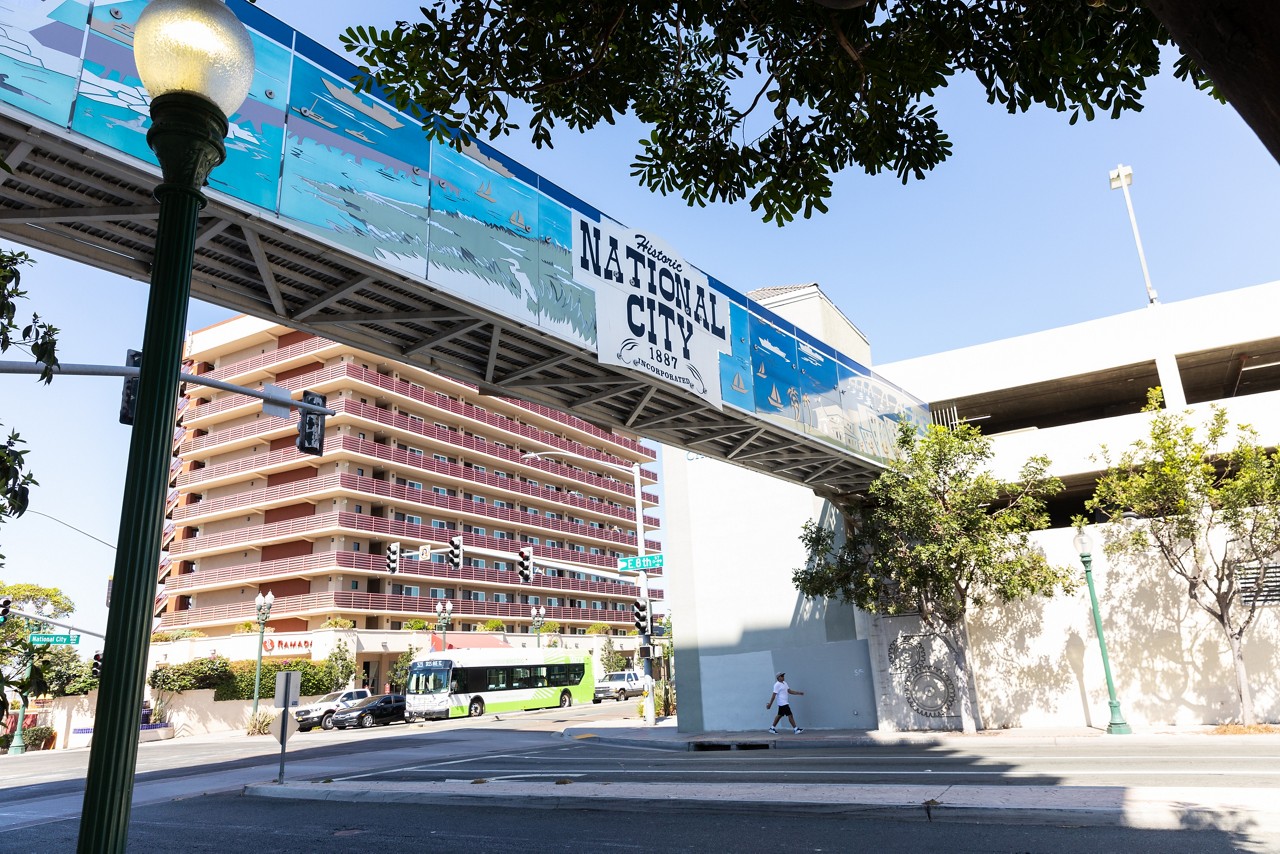 The intersection of National City Boulevard and East 8th St lies along the 8th Street Corridor, an area of redevelopment linking the 8th Street Trolley Station and Downtown National City to encourage walking, bicycling and public transit use in National City, California.