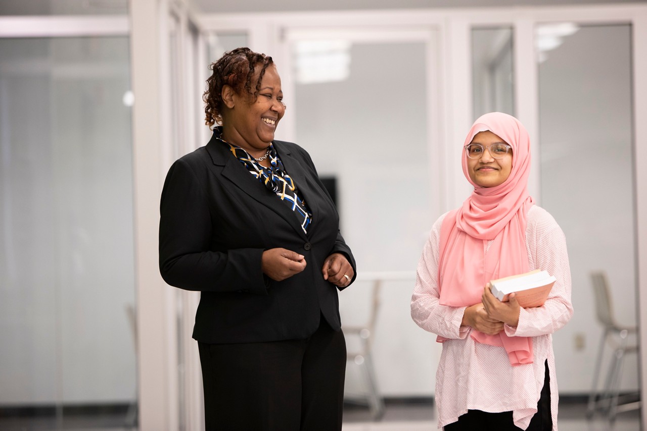 Moshammet Jarin (right) is a Senior at Glades Central Community High School (she also takes classes at Palm Beach State University). She  participates in the "Students to Seniors" program where students teach technoogy tips and tricks to older folks within the community. Sherry Canty (left) is a Magnet Coordinator for the Palm Beach County School District.