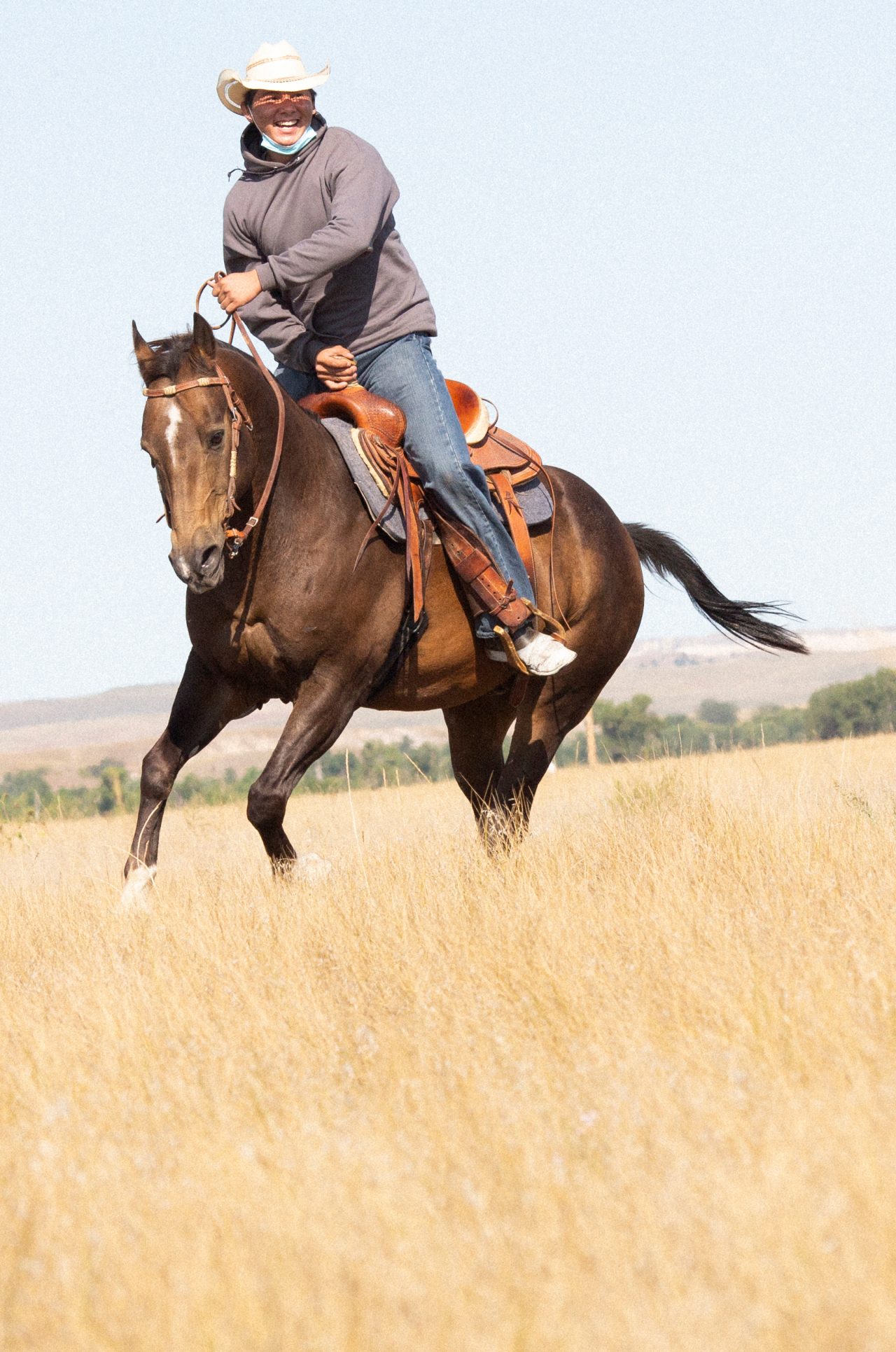 Taylen Garnette on a ride outside the corral. The Thunder Valley Community Development Corporation workforce cohort participates in Equine Therapy. The exercise encourage mental health through the physical interaction between horse and human. The participants work on trust and relaxation as they ride the horses without a saddle or reins.
The people of Thunder Valley are tapping their warrior spirits to reclaim their identities, culture, and language. They are committed to clearing a path forward for generations to come. At the core of the Culture of Health journey is how action is taken by the community—not for the community. The mission includes reclaiming language and culture, healing from trauma, providing homes and creating a safe and regenerative community, and developing work-force skills by looking at the whole person and getting them ready for the workforce physically, mentally, socially, and spiritually. Pine Ridge Reservation, South Dakota. September 17, 2021 (Photo by Samantha Appleton)
The people of Thunder Valley are tapping their warrior spirits to reclaim their identities, culture, and language and heal from historical and present-day trauma. They are committed to clearing a path forward for generations to come. At the core of the Culture of Health journey is how action is taken by the community—not for the community. The mission includes reclaiming language and culture, healing from trauma, providing homes and creating a safe and regenerative community, and developing work-force skills by looking at the whole person and getting them ready for the workforce physically, mentally, socially, and spiritually. Pine Ridge Reservation, South Dakota. September 17, 2021 (Photo by Samantha Appleton)
The people of Thunder Valley are tapping their warrior spirits to reclaim their identities, culture, and language and heal from historical and present-day trauma. They are committed to clearing a path forward for generations to come. At the core of the Culture o Taylen Garnette on a ride outside the corral. The Thunder Valley Community Development Corporation workforce cohort participates in Equine Therapy. The exercise encourage mental health through the physical interaction between horse and human. The participants work on trust and relaxation as they ride the horses without a saddle or reins.
The people of Thunder Valley are tapping their warrior spirits to reclaim their identities, culture, and language. They are committed to clearing a path forward for generations to come. At the core of the Culture of Health journey is how action is taken by the community—not for the community. The mission includes reclaiming language and culture, healing from trauma, providing homes and creating a safe and regenerative community, and developing work-force skills by looking at the whole person and getting them ready for the workforce physically, mentally, socially, and spiritually. Pine Ridge Reservation, South Dakota. September 17, 2021 (Photo by Samantha Appleton)
The people of Thunder Valley are tapping their warrior spirits to reclaim their identities, culture, and language and heal from historical and present-day trauma. They are committed to clearing a path forward for generations to come. At the core of the Culture of Health journey is how action is taken by the community—not for the community. The mission includes reclaiming language and culture, healing from trauma, providing homes and creating a safe and regenerative community, and developing work-force skills by looking at the whole person and getting them ready for the workforce physically, mentally, socially, and spiritually. Pine Ridge Reservation, South Dakota. September 17, 2021 (Photo by Samantha Appleton)
The people of Thunder Valley are tapping their warrior spirits to reclaim their identities, culture, and language and heal from historical and present-day trauma. They are committed to clearing a path forward for generations to come. At the core of the Culture o