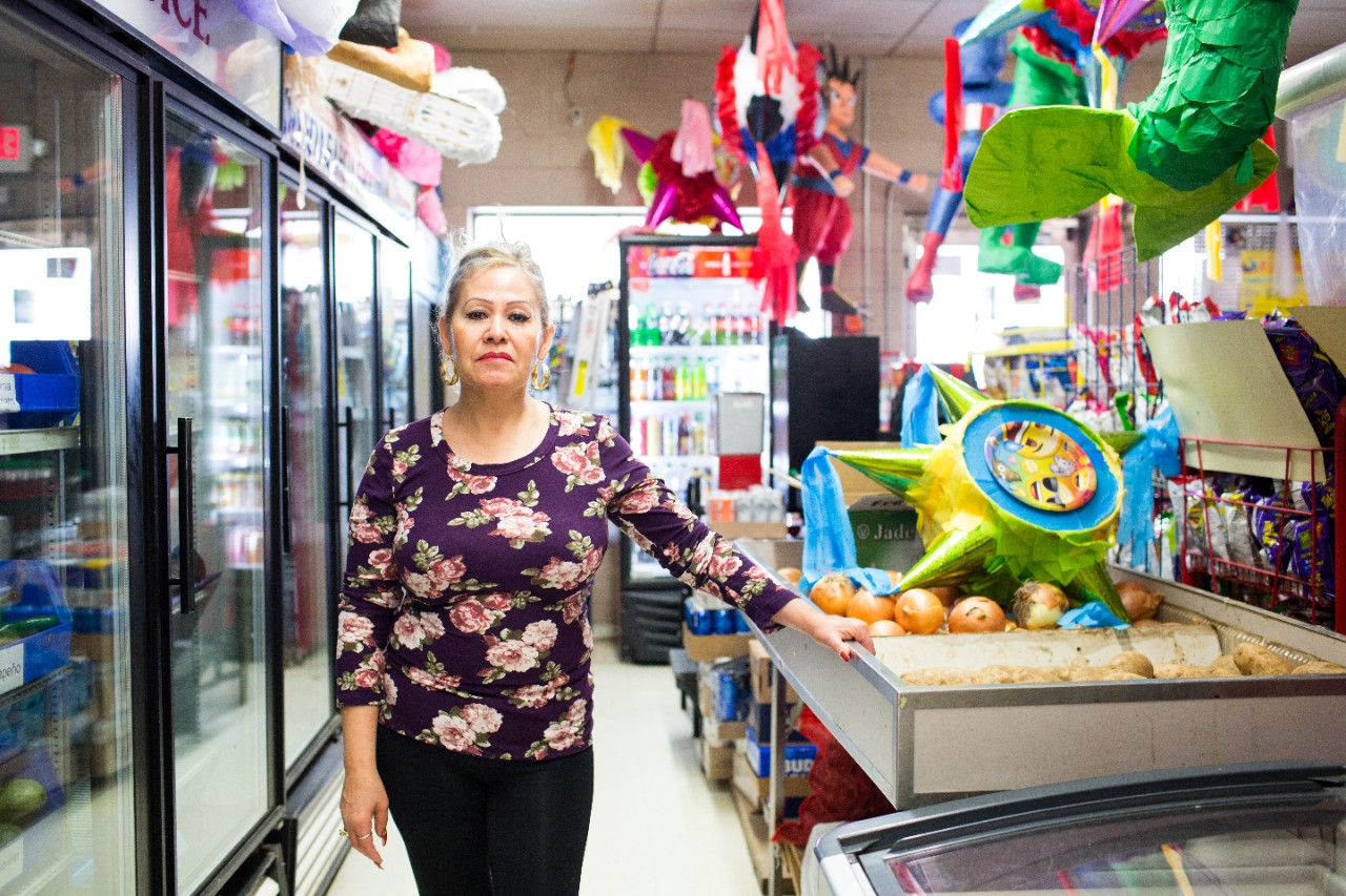 Luz Garcia, owner of Garcia Carniceria and Restaurant, serves customers in Garden City, Kansas. Originally from Jalisco, Mexico, she has lived in Kansas for 25 years.  
In 1990, Luz Garcia came to Kansas for what she calls the “Mexican Dream,” the opportunity to earn a living and care for her family. Her brother was already in Finney County, working at Tysons. She met her husband here; she worked at Tyson for 7 years and he worked there for 22. The Garcias always planned to open businesses in Mexico, but when Luz’s mom passed away and a friend offered a chance to take over the carnicería (butcher shop), they decided to take the opportunity. 
The big stores like Sam’s Club don’t bring down her business she says. In fact, they come to see how her shop operates and check her prices. On pay day, her shop is always full. 
Garden City has a large Hispanic community,  making up 48% of the population according to the 2010 census. Garcia's is one of several Mexican businesses downtown.