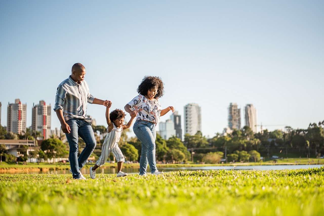 Family strolling in a city park.