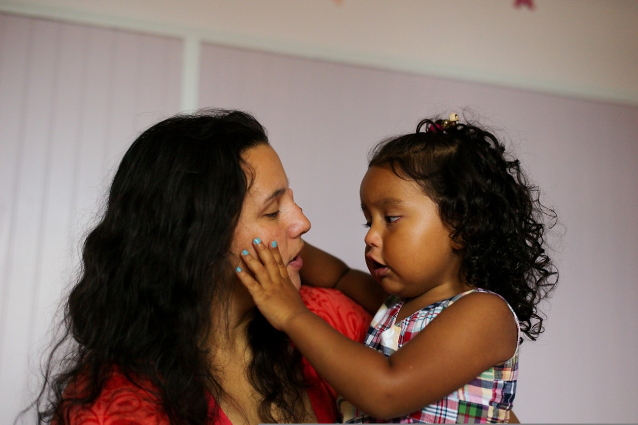  A nurse checks a hospital patient.