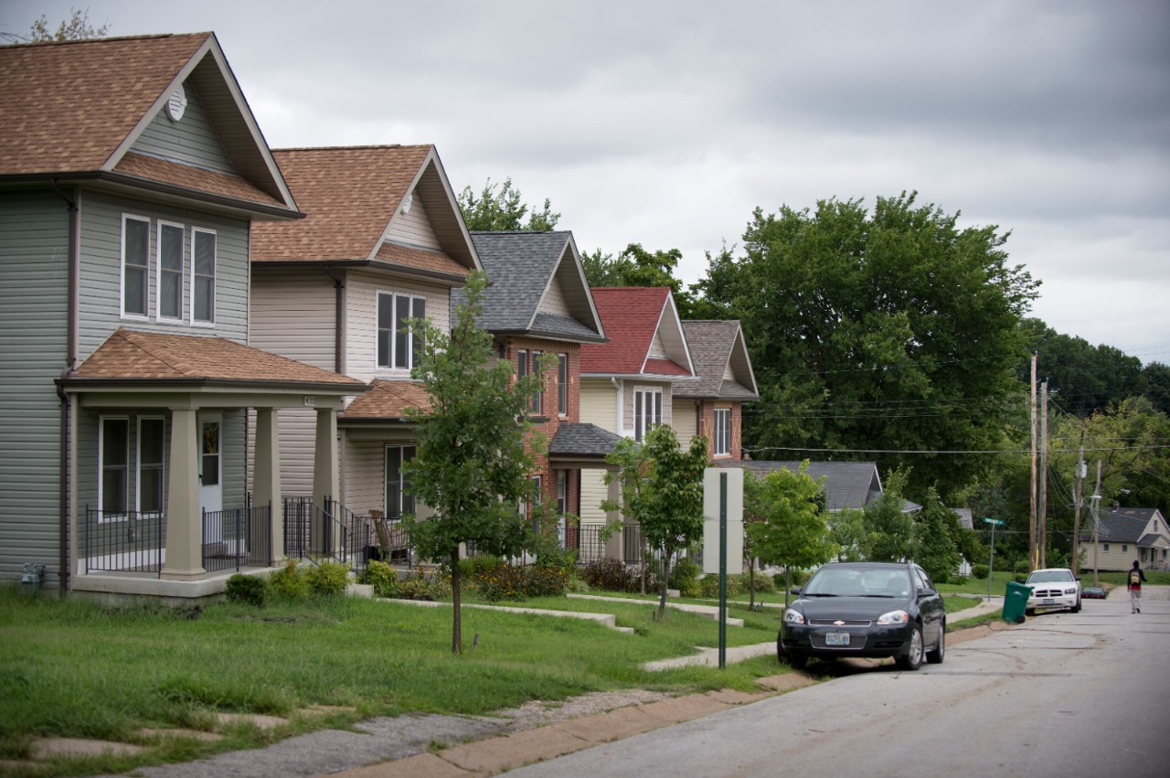 Street view of a row of houses.