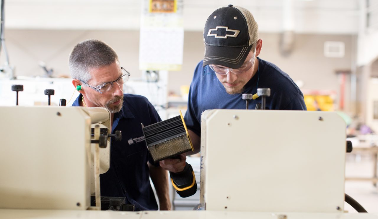 Algoma, WI COH 2017. Wolf Tech is a VoTech that enables high school students to recieve college credits. Mark Zastrow (left) is a Press Operator at WS Packaging and teaches students at Wolf Tech. Justyn Krausslactt (right) learns the details associated with Flexo Printing.
