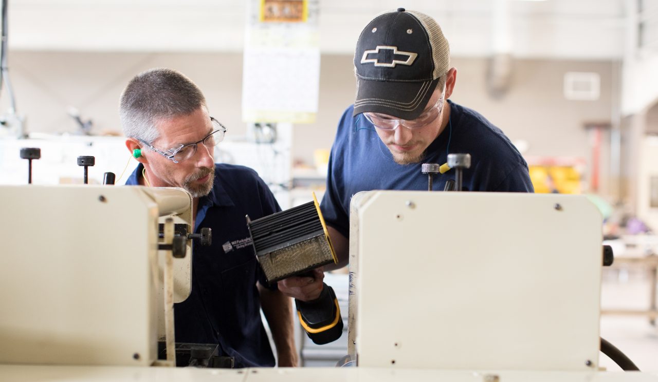 Algoma, WI COH 2017. Wolf Tech is a VoTech that enables high school students to recieve college credits.  Mark Zastrow (left) is a Press Operator at WS Packaging and teaches students at Wolf Tech. Justyn Krausslactt (right) learns the details associated with Flexo Printing.