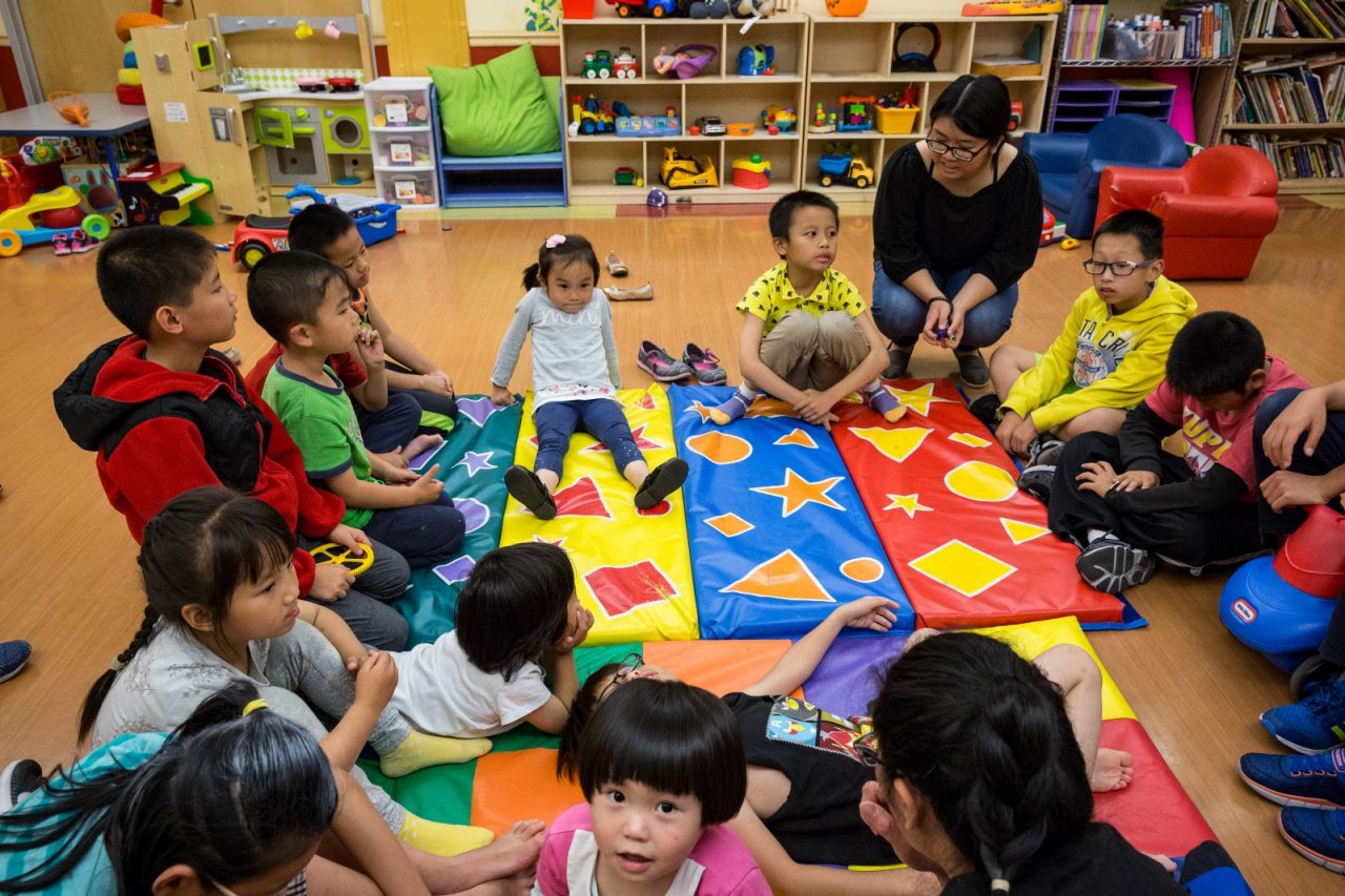 Children from SRO families play at the San Francisco Chinatown YMCA while the adults prepare the dining room for the Thursday night dinner.