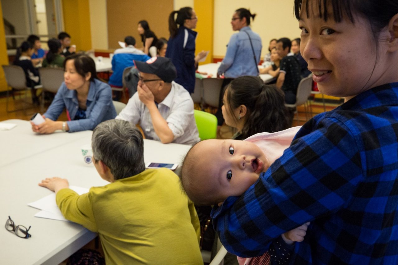 SRO families meet prior to the Thursday night dinner at the San Francisco Chinatown YMCA.