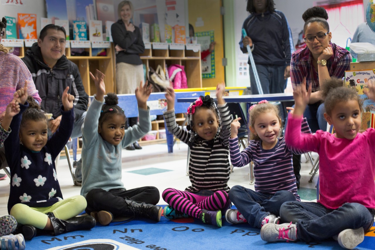 Children and their parents participate in an activity with representatives of the Food Trust at the Center for Family Services Pine Street School in Camden, NJ. Kim Fortunado of Campbell's also participated. Cameden, NJ, (Photo by Samantha Appleton)