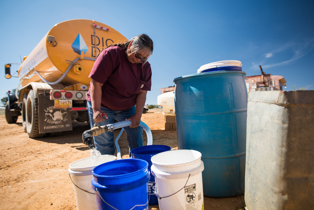 Darlene Arviso fills water tanks for Navajo tribal members who do not have access to running water. 