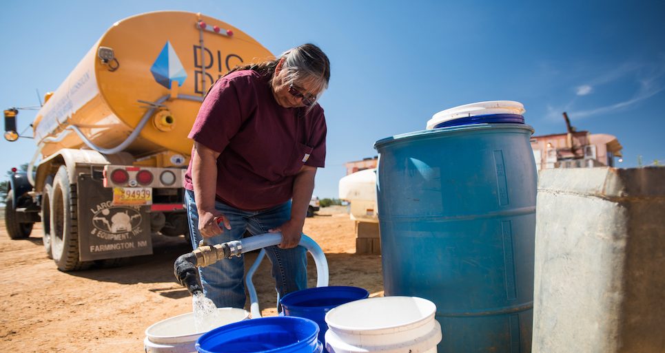 Darlene Arviso fills water tanks for Navajo tribal members who do not have access to running water. 