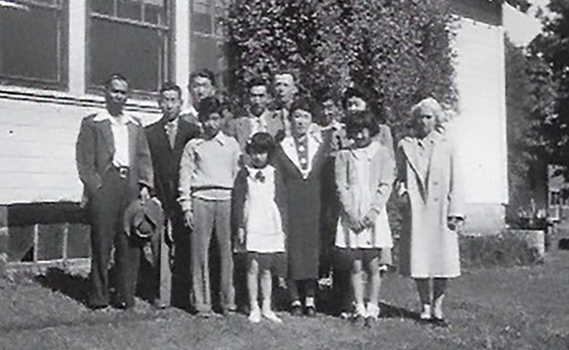 Dr. Morita's father's family with neighbors in Oregon just before they were forcibly removed from their homes and incarcerated without due process in internment camps.