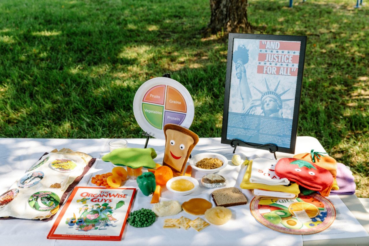 Healthy food is displayed outside on a table.