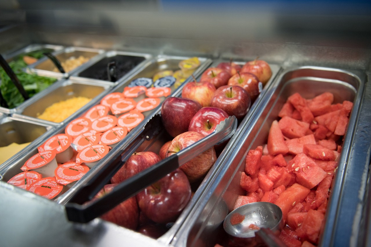 Students get lunch from the cafeteria at Tanglewood Middle School, which participates in a healthy school lunch program. The Food and Nutrition Services department sources from local farms and receives extra training to create healthier meal options for students.