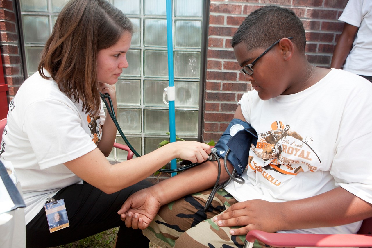 Health Fair and Blood Pressure screening at the Cut Off center in Algiers, La. on July 1, 2011. The health fair, which included the giving out of information about LACHIP and medicaid eligibility, was held during the T.E.A.M. (Together Each Achieves More) Football and Cheerleading Camp put on by NFL player Robert Royal. Everyone is released.