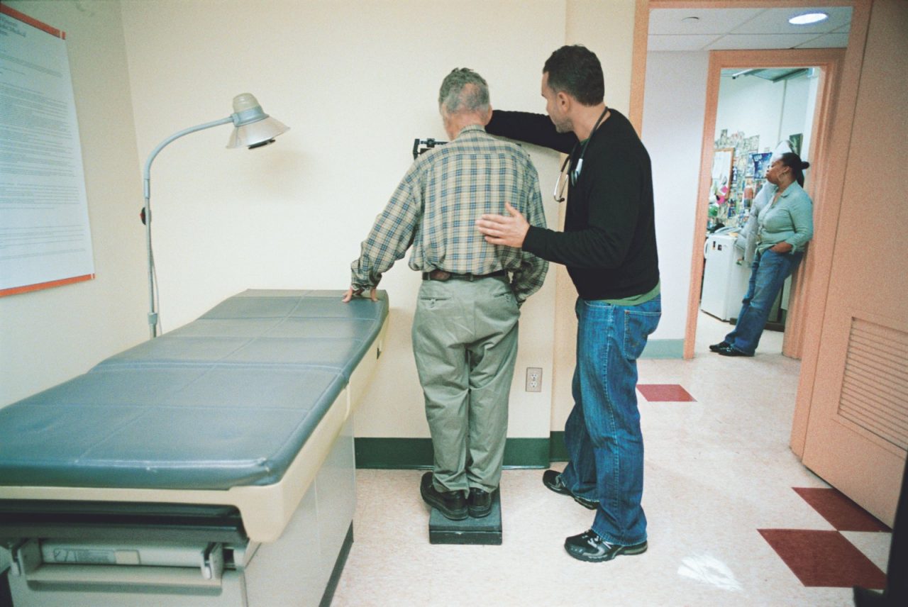 Mark Ragner, MD, weighs a patient in St. Vincent's Hospital, New York, NY. 2007 Annual Report