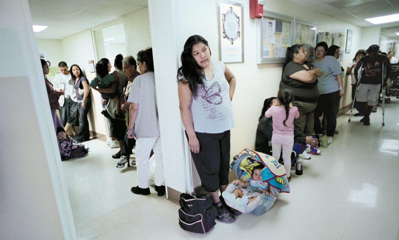 Patients waiting in line to see doctors at a clinic,  San Xavier Health Center Tucson, Arizon. 2007 Annual Report