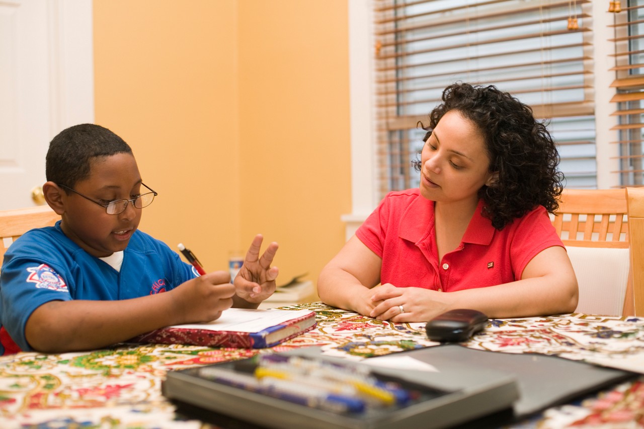 Esther Lopez and her nephew. Lopez, a dental student at the University of Illinois at Chicago, participates in the Pipeline, Profession and Practice.