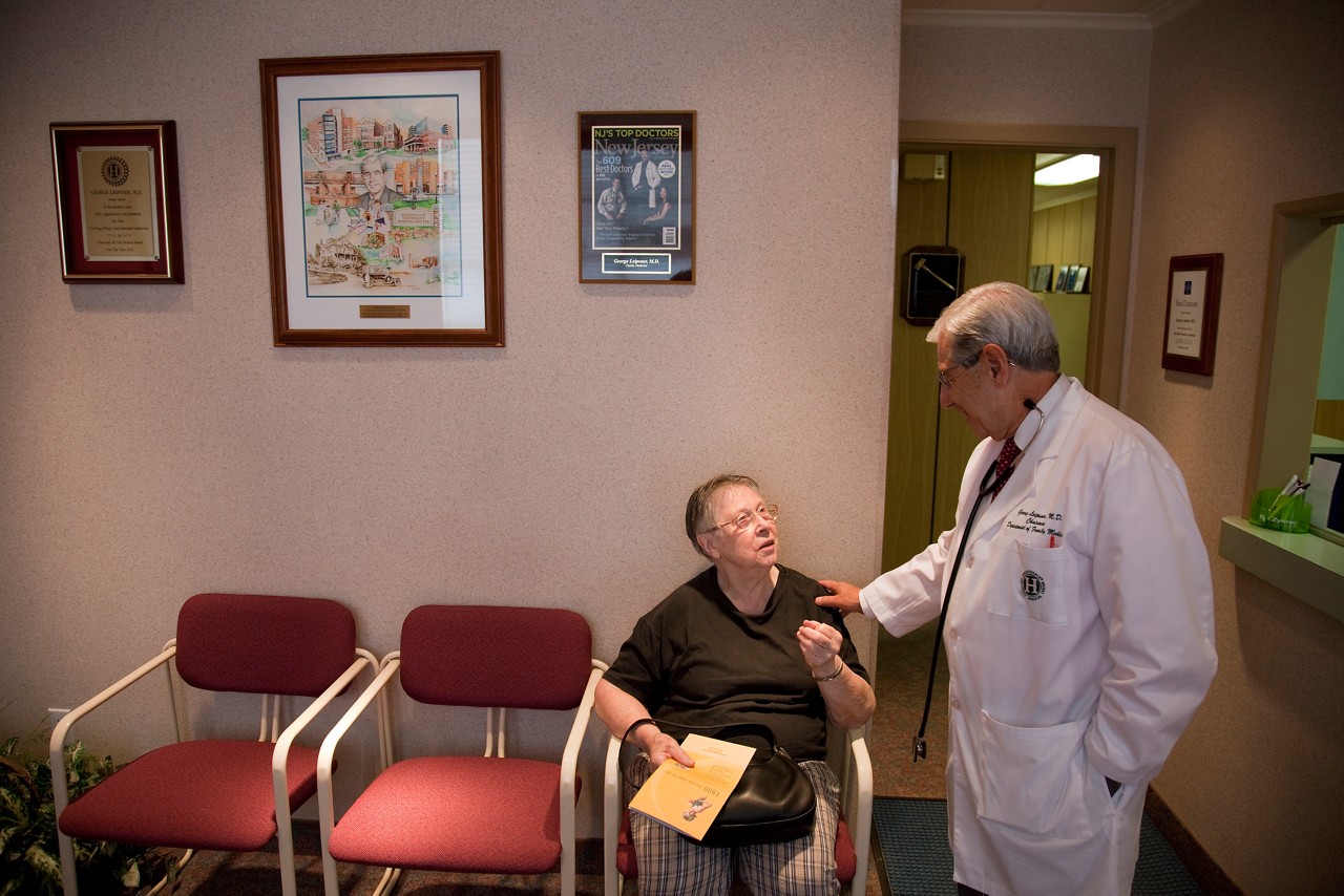 Dr. Leipsner talks with a patient in the waiting room in the office of Dr. George Leipsner in Maywood, NJ.
