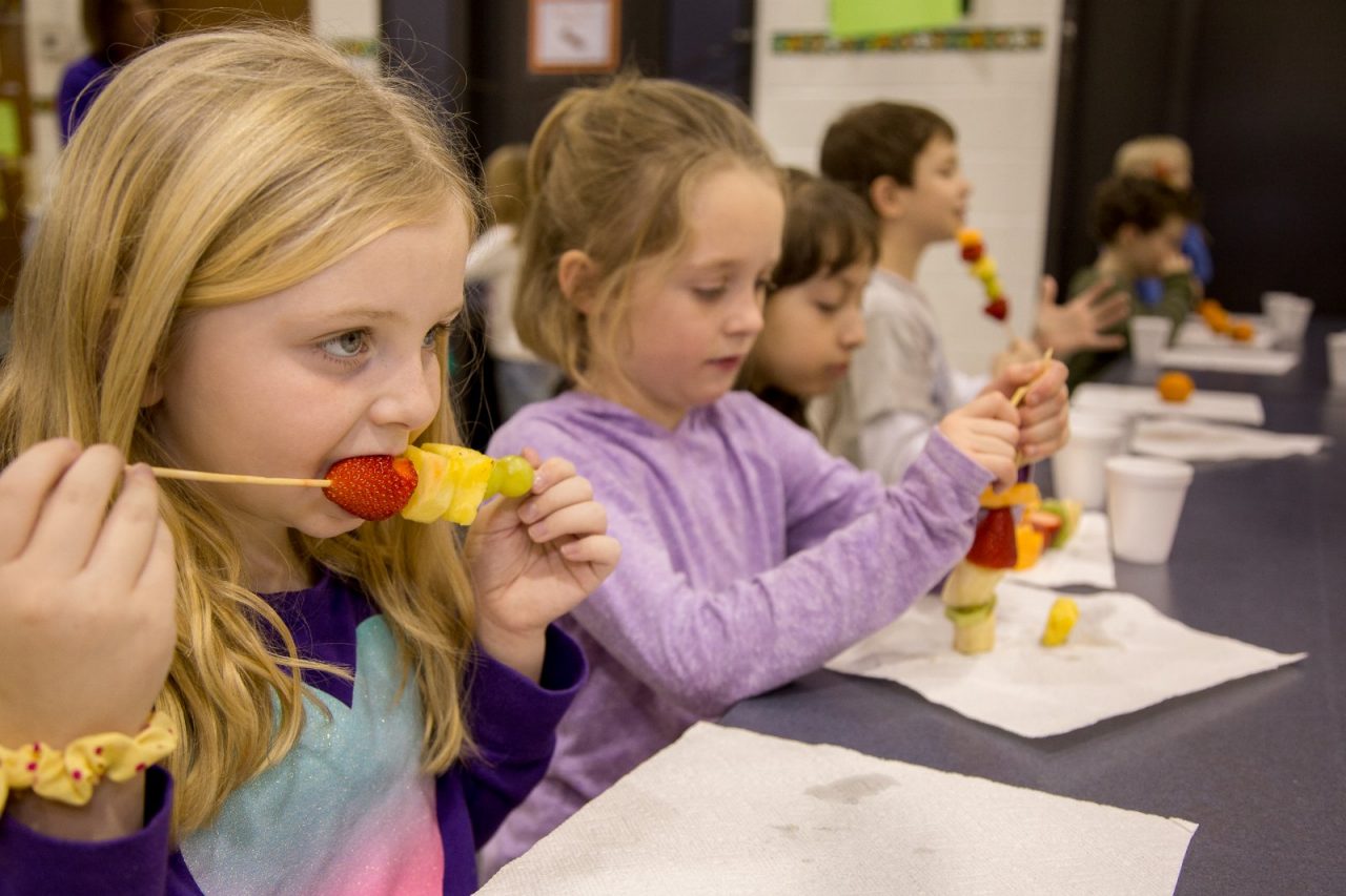 Children exercise and eat a healthy snack at the Tri-Town YMCA in Lombard, IL.