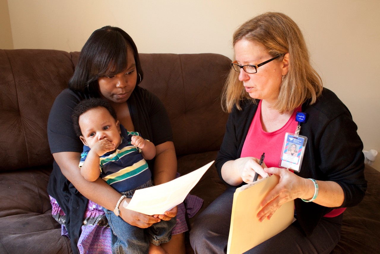 Jeanette Sorrells, mom and baby Samir Johnson, with Child First team member Monarae Scales. Child First program care coordinators and clinicians meet with families in Norwalk, CT