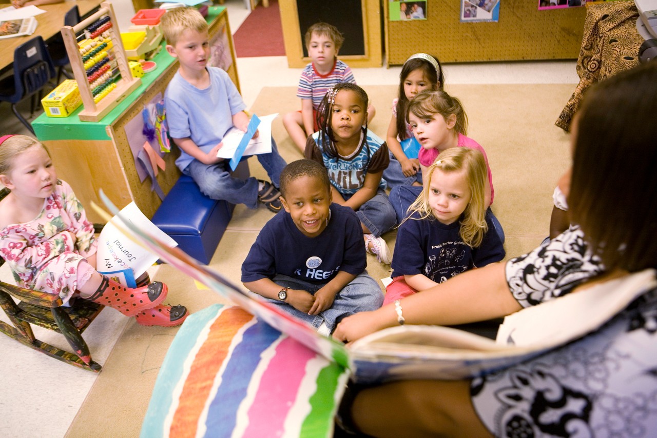 Josh Singleton and other preschool students listen as their teacher Erin Webb, reads them a book. Frank Porter Graham Child Development Center. Chapel Hill, North Carolina.