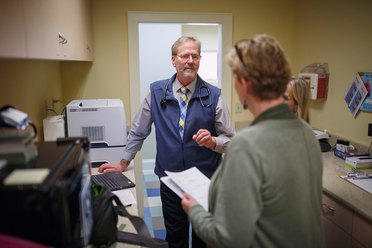 Dr. Steven Crane discusses a patient's needs with nurses at The Free Clinics in Hendersonville NC.