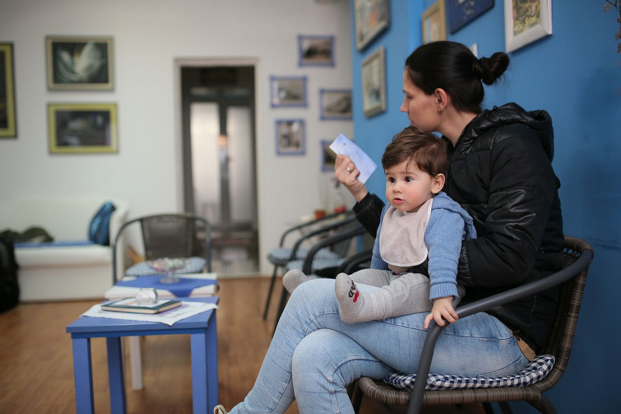 Young woman and her son at the doctor.