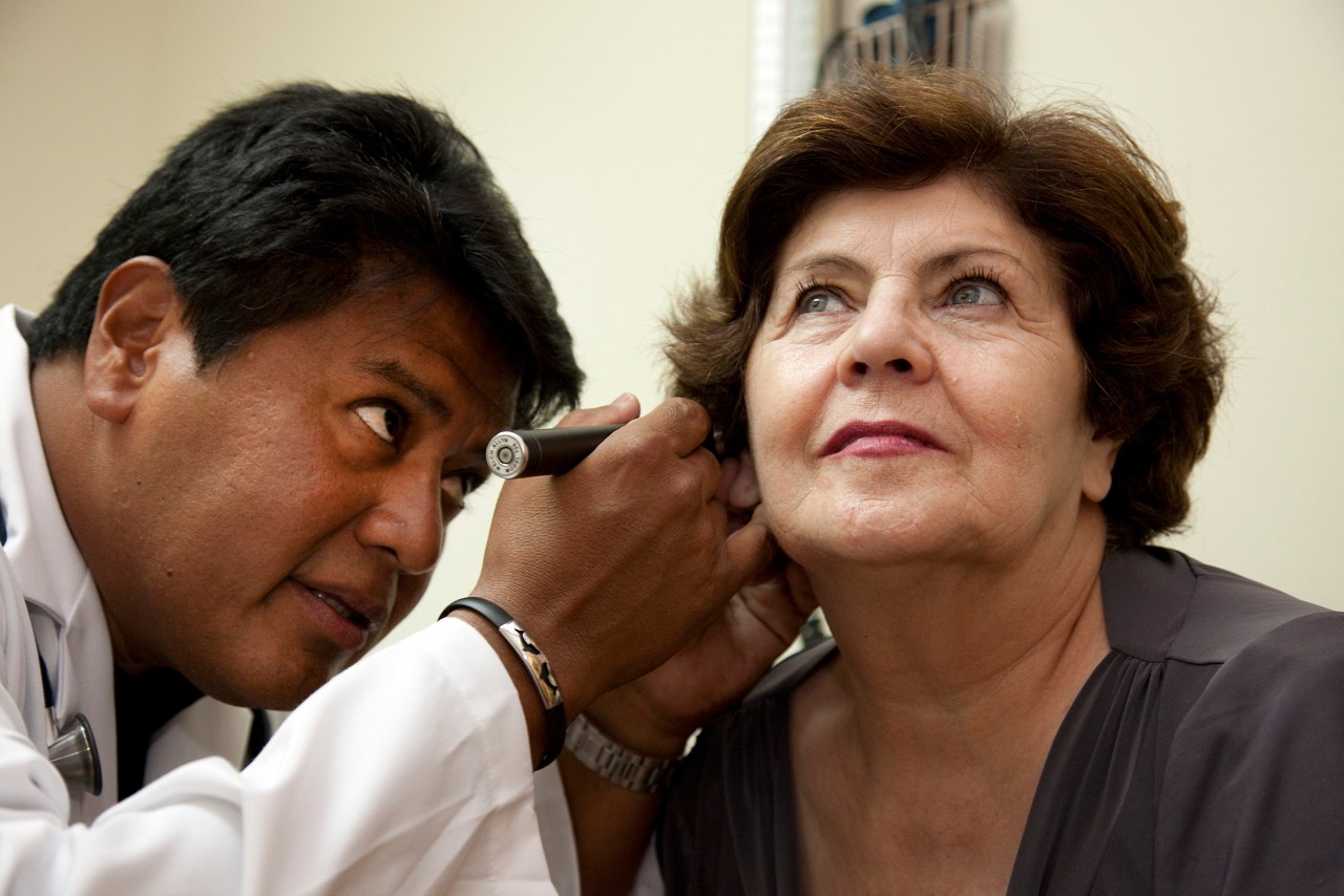 A doctor gives a check up to his patient in the office of Dr. Jose Flores in Glen Ridge, NJ.

