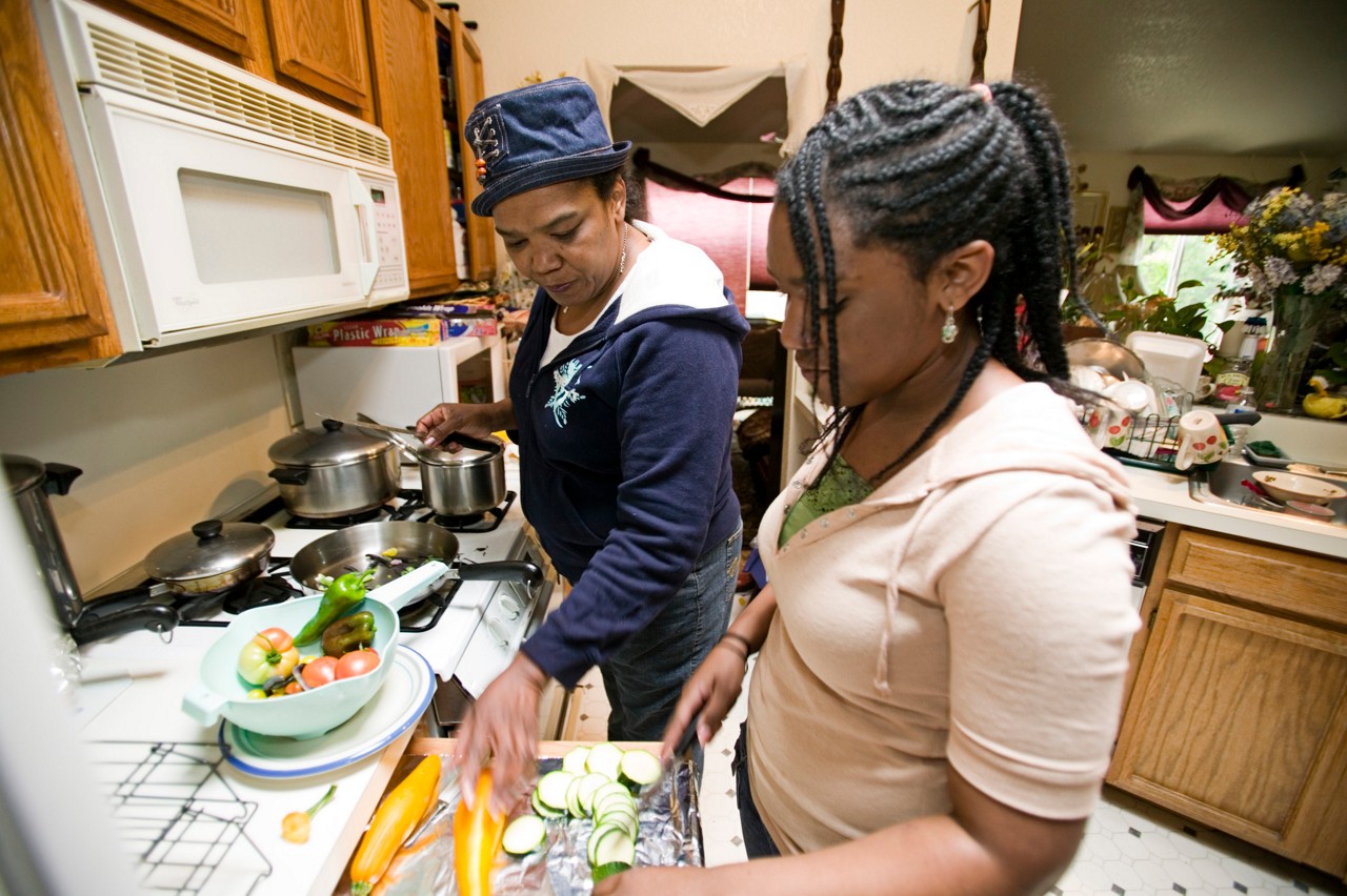 Carol Prevost, a diabetic, and her daughter, Monuque preparing vegetables from their garden.  Improving Chronic Illness Care.