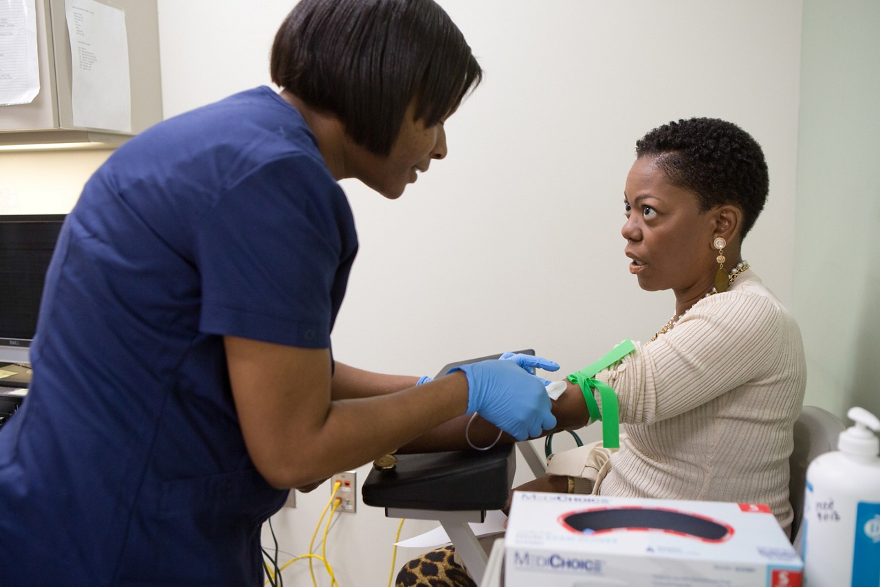 Monica K. Bass, patient getting blood drawn and seeing oncologist and hematologist, Dr. Tondre Buck.