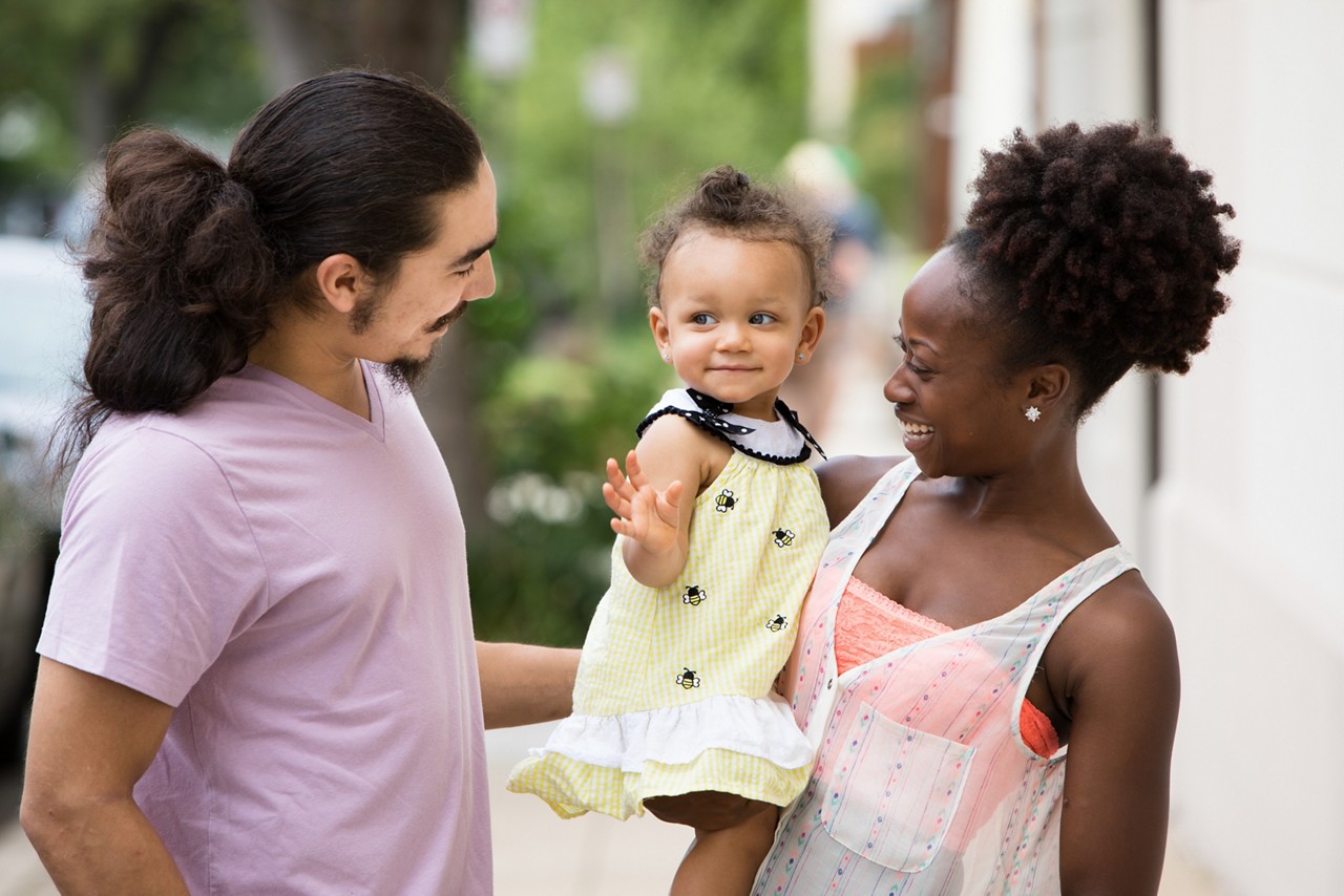 A family on a city street. Richmond, VA COH 2017.