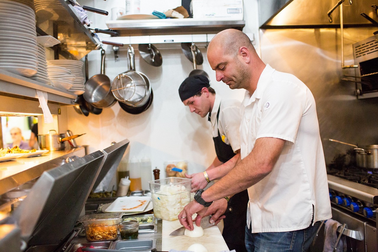 Eric Wuppermann prepares a meal at Treeline Kitchen, the restaurant he opened with his wife Christine Street in Leadville, Colorado in 2017.