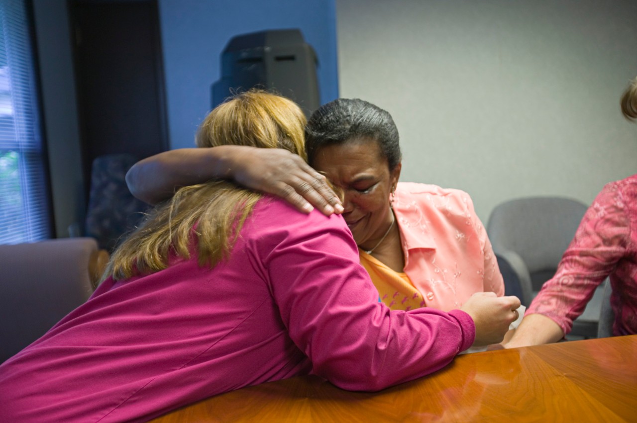 Patient, Carol Prevost, hugging Shari Gioimo, CMA, in a mini meeting at St. Peter Family Practice, Olympia, Washington.  Improving Chronic Illness Care