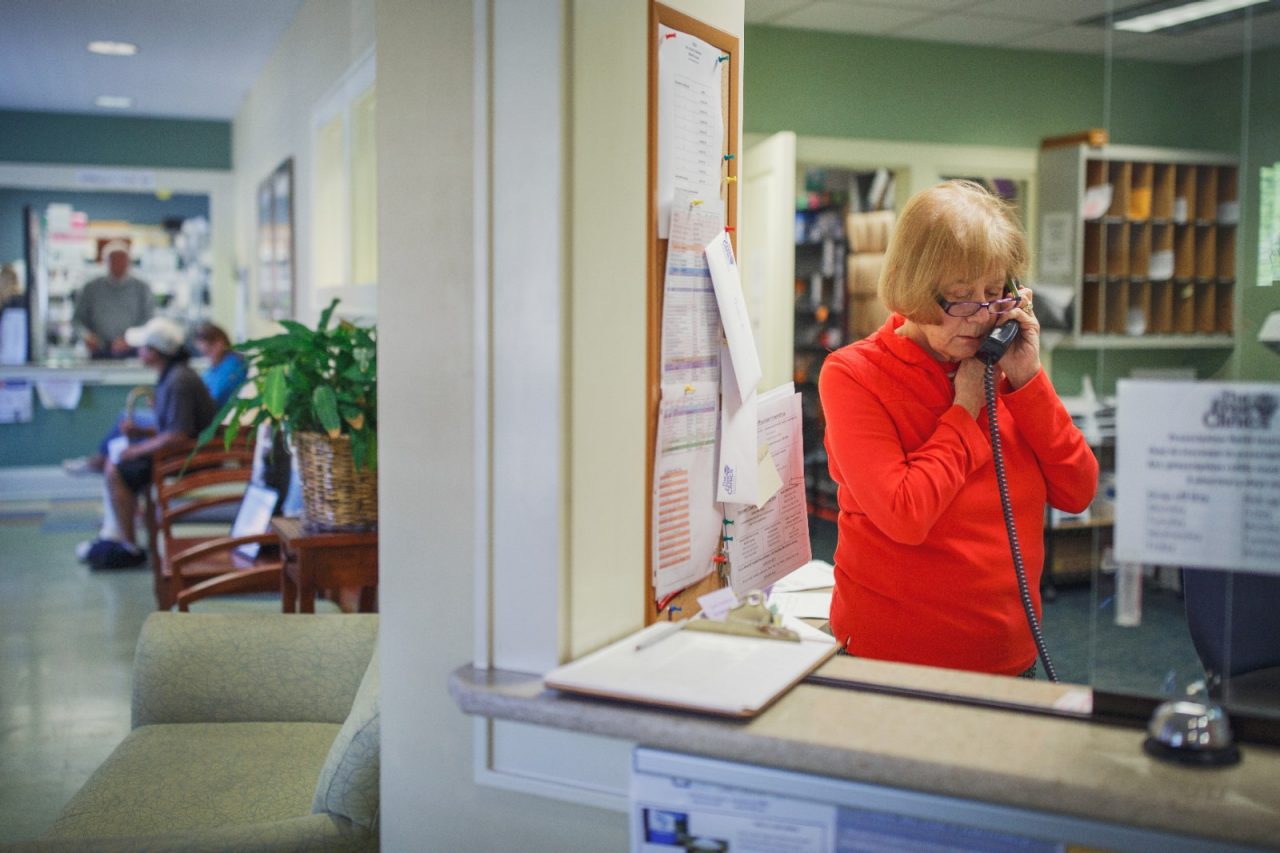Volunteer Jodi Scott works at the front desk of The Free Clinics in Hendersonville, NC. The clinic relies on community support and its volunteers which number around 300.