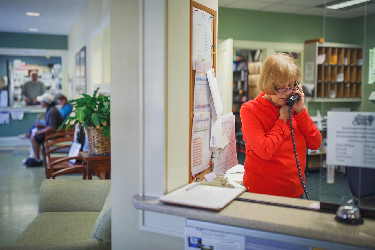 Volunteer Jodi Scott works at the front desk of The Free Clinics in Hendersonville, NC. The clinic relies on community support and its volunteers which number around 300.