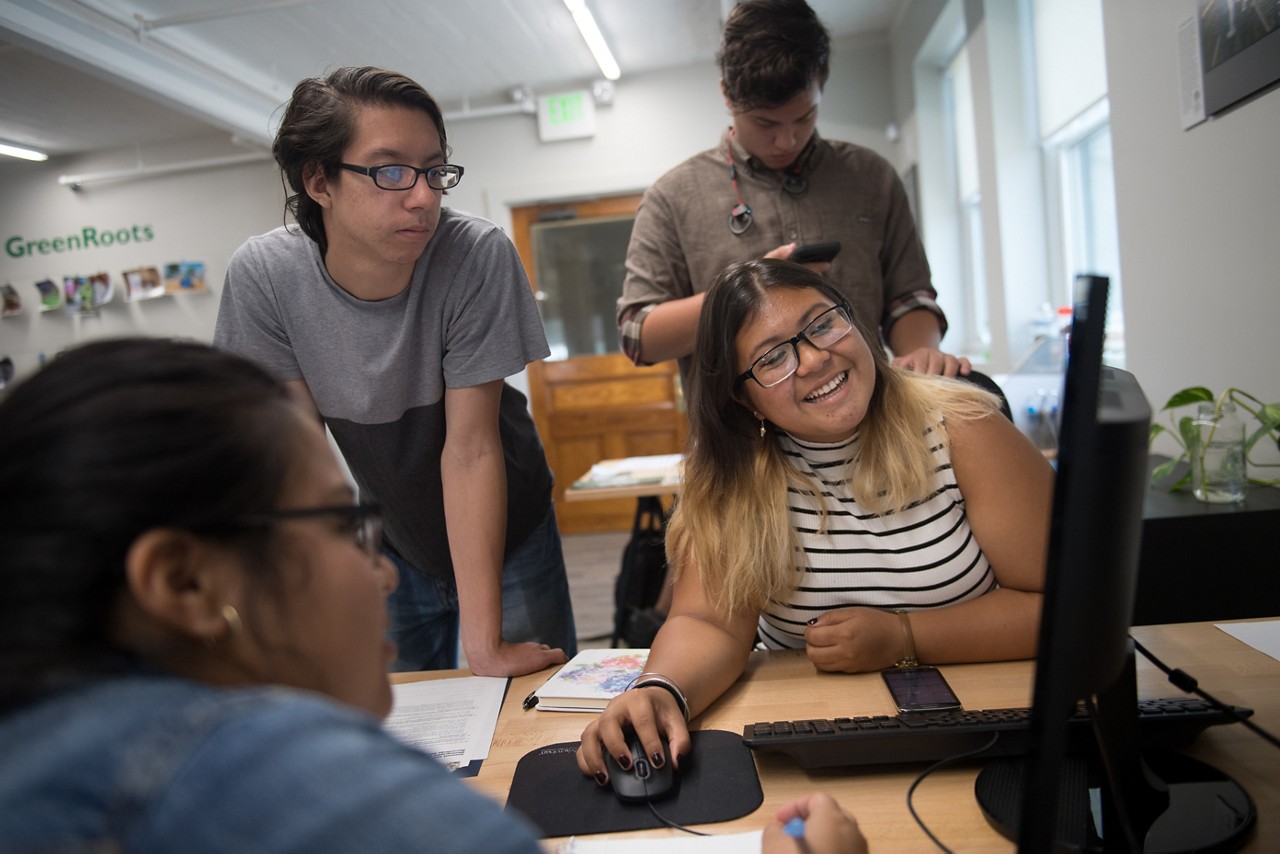 Members of the ECO (Environmental Chelsea Organizers) Youth, work on a campaign together at the GreenRoots office, which is situated on the Chelsea Creek waterfront. (AEM DAM Chelsea Story)