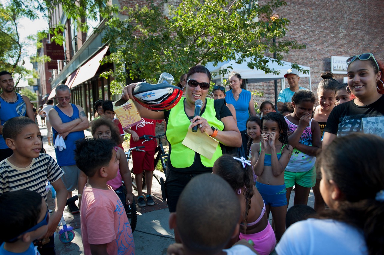 A community leader speaking at a neighborhood gathering.