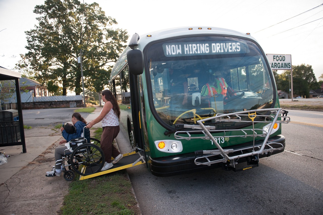 Greenville County resident Rhonda Herrington is wheeled off the bus by her daugher, Holly Herrington, as they ride Greenlink transit on a Wednesday morning. Greenville Transit Authority will utilize a federal grant to expand their service, including later hours and more buses.