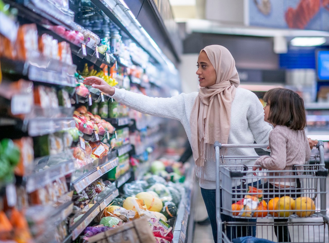 A Muslim mother and daughter grocery shop.