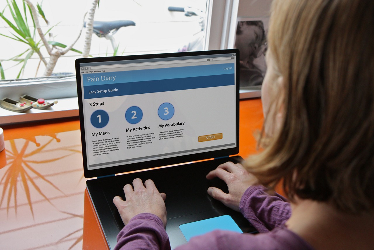A woman using a computer to gather information.