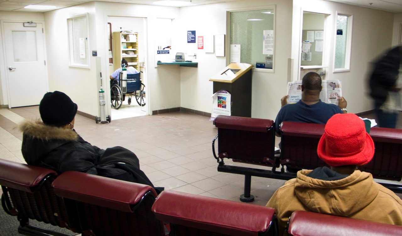 People sitting in a hospital waiting room.  Expecting Success