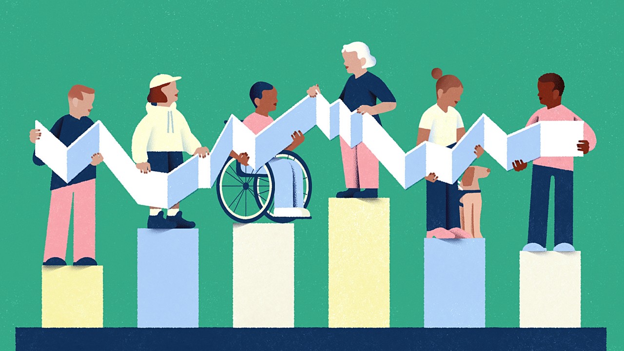 A father and son walking on a sidewalk while a bus passes by.