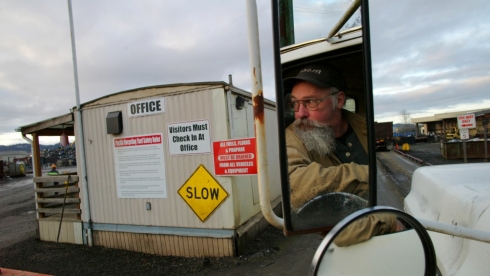 A truck driver at a recycling facility.