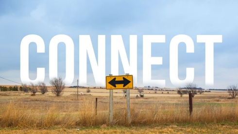 Farmland and street sign.