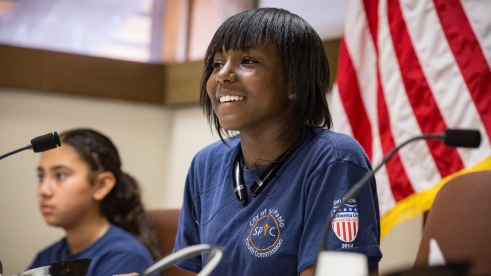 Teens at a council meeting.